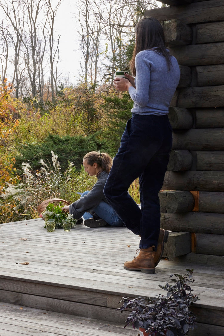 two women on wood porch in nature