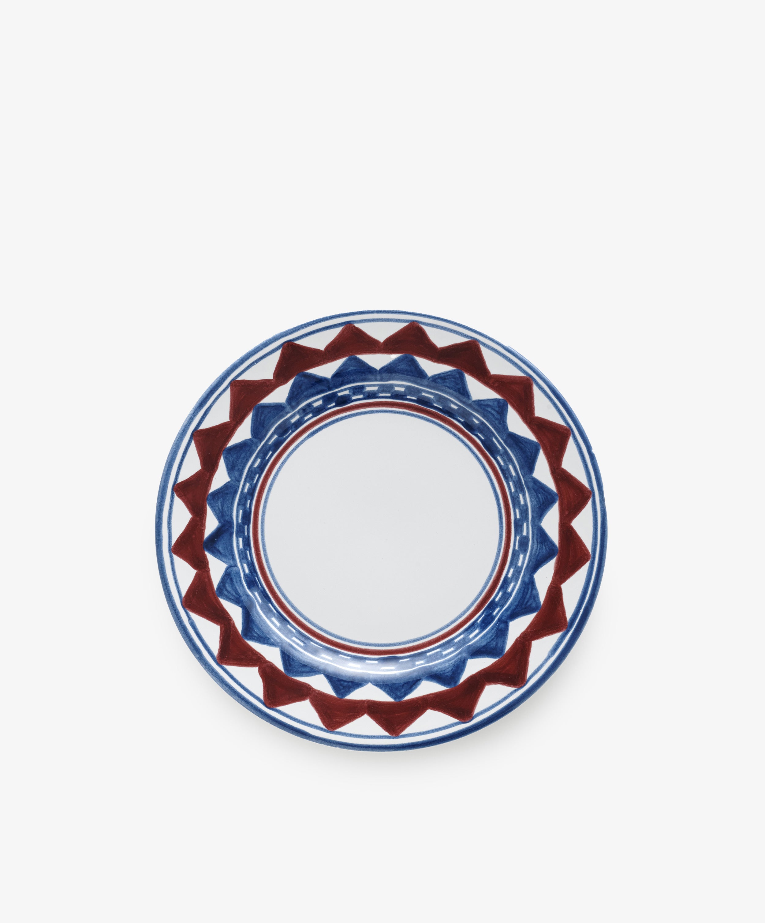 The Luca Small Plate, Set of 4, features round ceramic plates hand-painted with a geometric blue and red pattern around the rim on a white background, inspired by classic PORTA-designed plates.