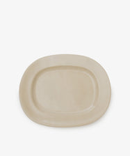 A large, rectangular off-white platter crafted from beige ceramic, set against a white background.