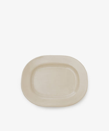 A simple off-white small rectangular ceramic platter with a matte finish is centered against a white background, making it ideal for everyday use.