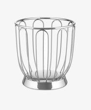 The Spicchio Citrus Basket by Alessi is a round, silver wire basket with wide vertical bars and an open top, serving as a sculptural kitchen accessory displayed on a plain white background.