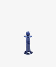 The Angelita Candleholder is an elegant, glossy dark blue handcrafted ceramic piece with a wide base and narrow neck, shown against a plain white background.