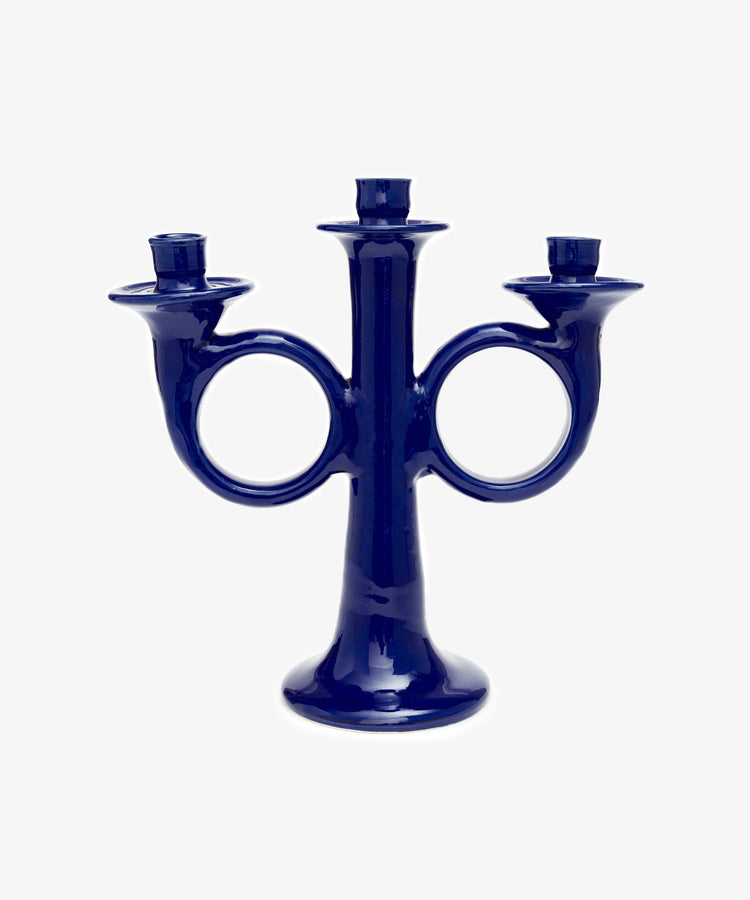 Loretta Candelabra. Dark blue glazed ceramic candle holder with sculptural shape and space for three candles.