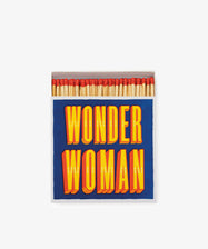 A box of Luxury Matches with a blue cover and bold yellow and red “WONDER WOMAN” text—a miniature masterpiece perfect for any fan’s collection.
