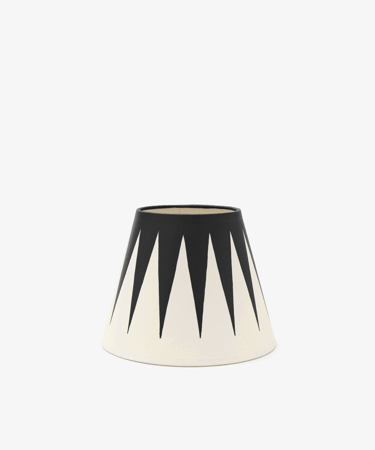 The Untitled 3 Hand-painted Lampshade features a conical shape, white base, and bold black downward-pointing triangles for a striking geometric look.