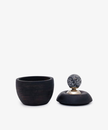 The Curiosity Box 15, made from dark African wood, is shown next to its matching lid featuring a round marbled stone handle, all set against a plain white background.
