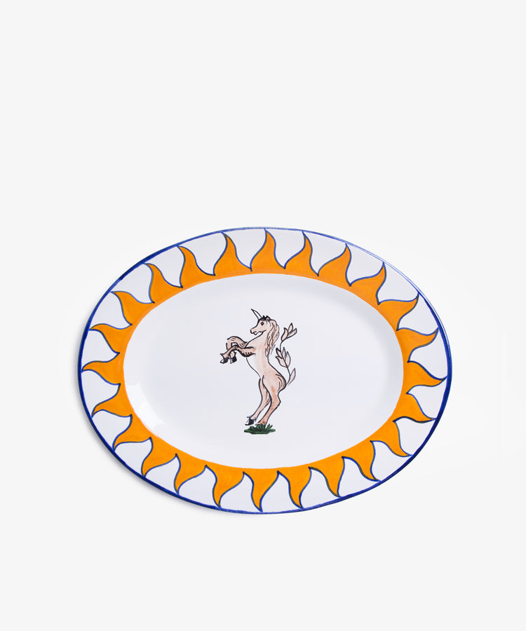 Palio Serving Platter. Glazed ceramic oval plate in orang and blue designs with unicorn motif.