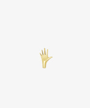 The Hand Paperweight, inspired by Viennese modernism, features five outstretched fingers in gold Auböck brass and is displayed on a plain white background—an iconic sculptural design.
