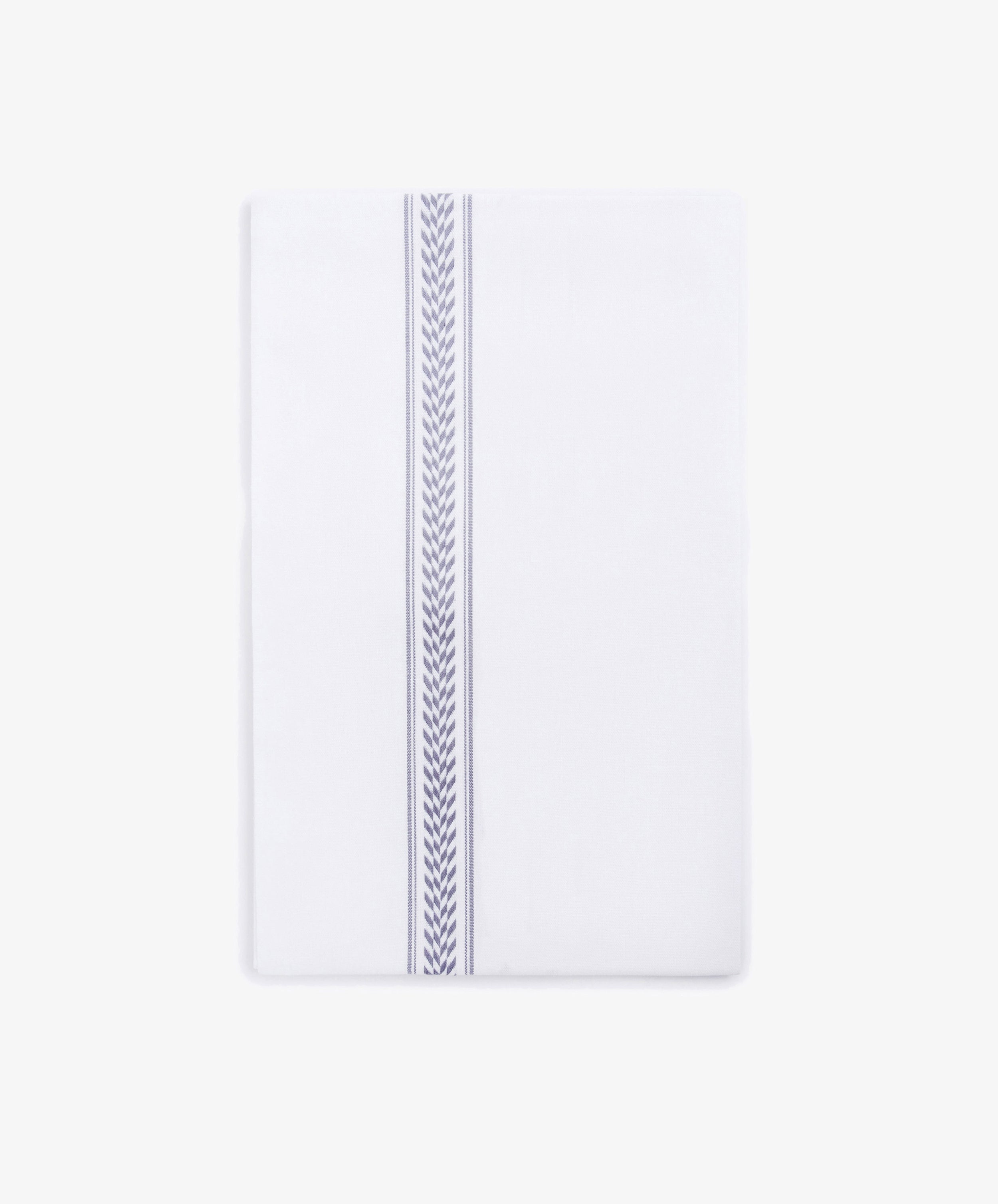 The Striped Tea Towel is a white, 100% cotton rectangular towel with a single blue chevron stripe running vertically near one edge, set against a plain white background.