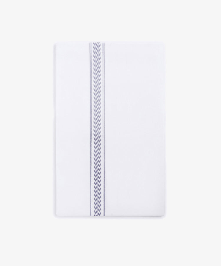 The Striped Tea Towel is a white, 100% cotton rectangular towel with a single blue chevron stripe running vertically near one edge, set against a plain white background.