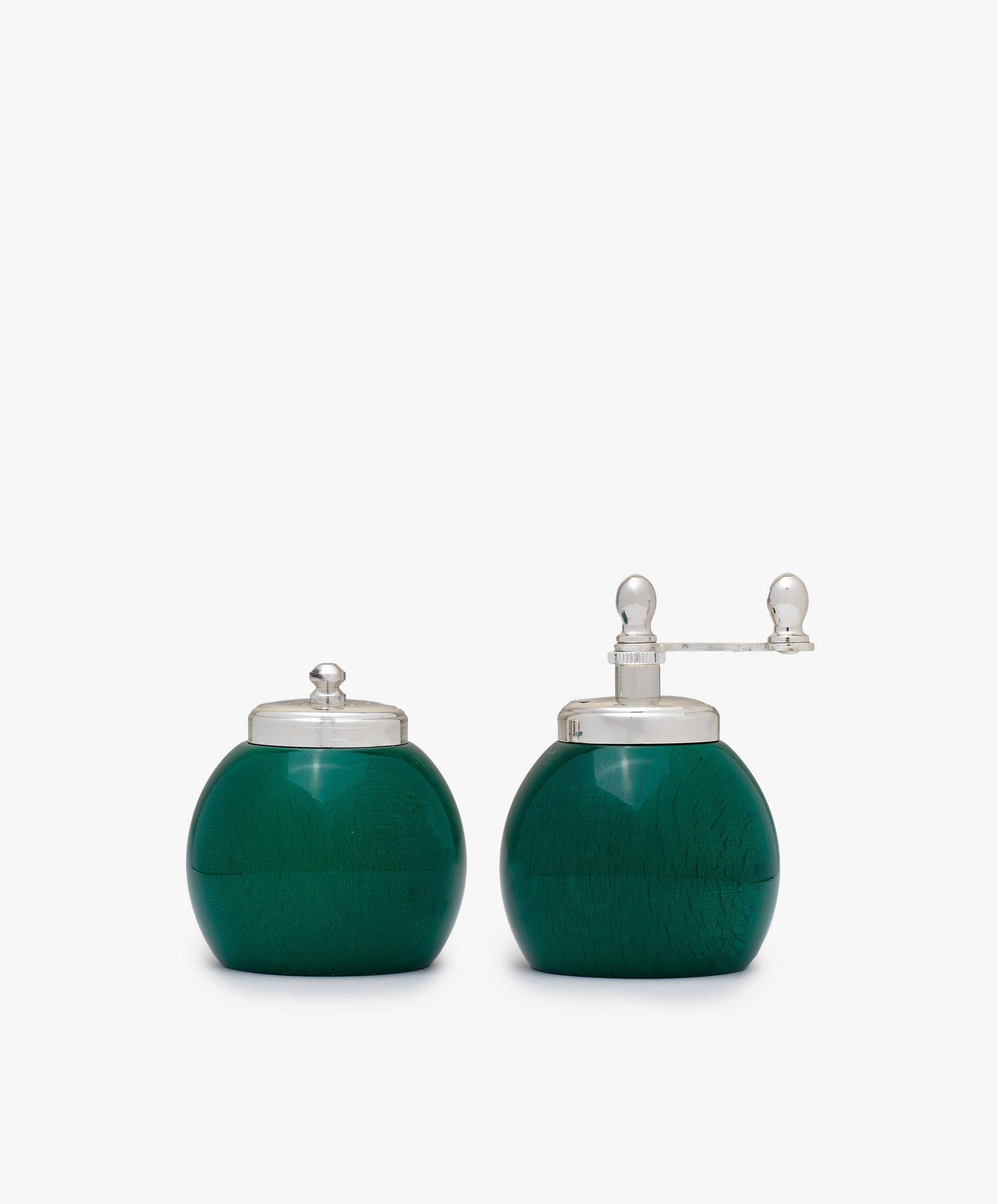 The Theo Pepper Mill and Salt Shaker set includes round, green painted wood mills with clear lids; the pepper mill features a side handle and superior grinding mechanism, while the other is a salt shaker.