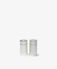 The Sophia Pepper Mill and Salt Shaker, both silver-plated and cylindrical with vertical ridges, exemplify Italian craftsmanship as they sit side by side on a plain white background.