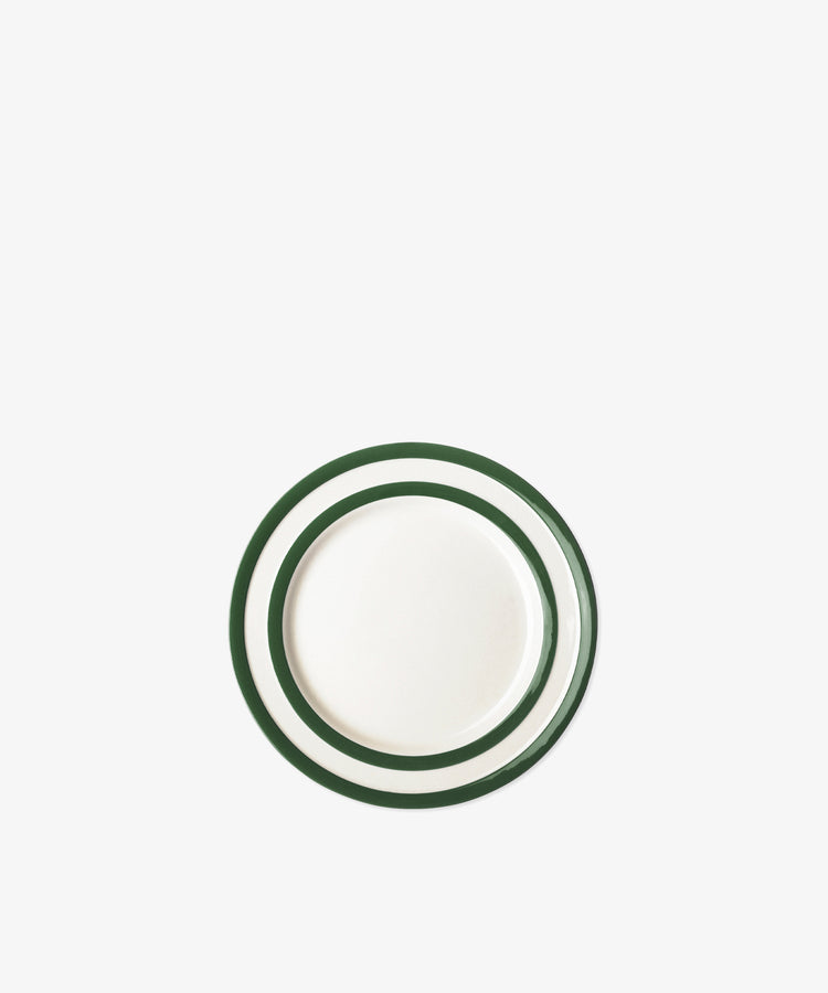 The Betty Breakfast Plate features a round white design with two green concentric rings near the rim, inspired by classic UK West Country pottery and displayed on a plain white background.