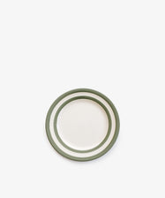 The Betty Breakfast Plate is a small white ceramic plate with two green circular stripes near the edge, inspired by classic UK West Country pottery, shown on a plain white background.