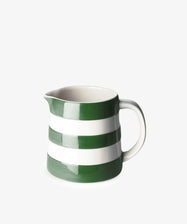 The Betty Large Dreadnought Jug is a ceramic piece inspired by UK West Country pottery, featuring green and white stripes, a sturdy handle, and a spout—ideal for your breakfast table.