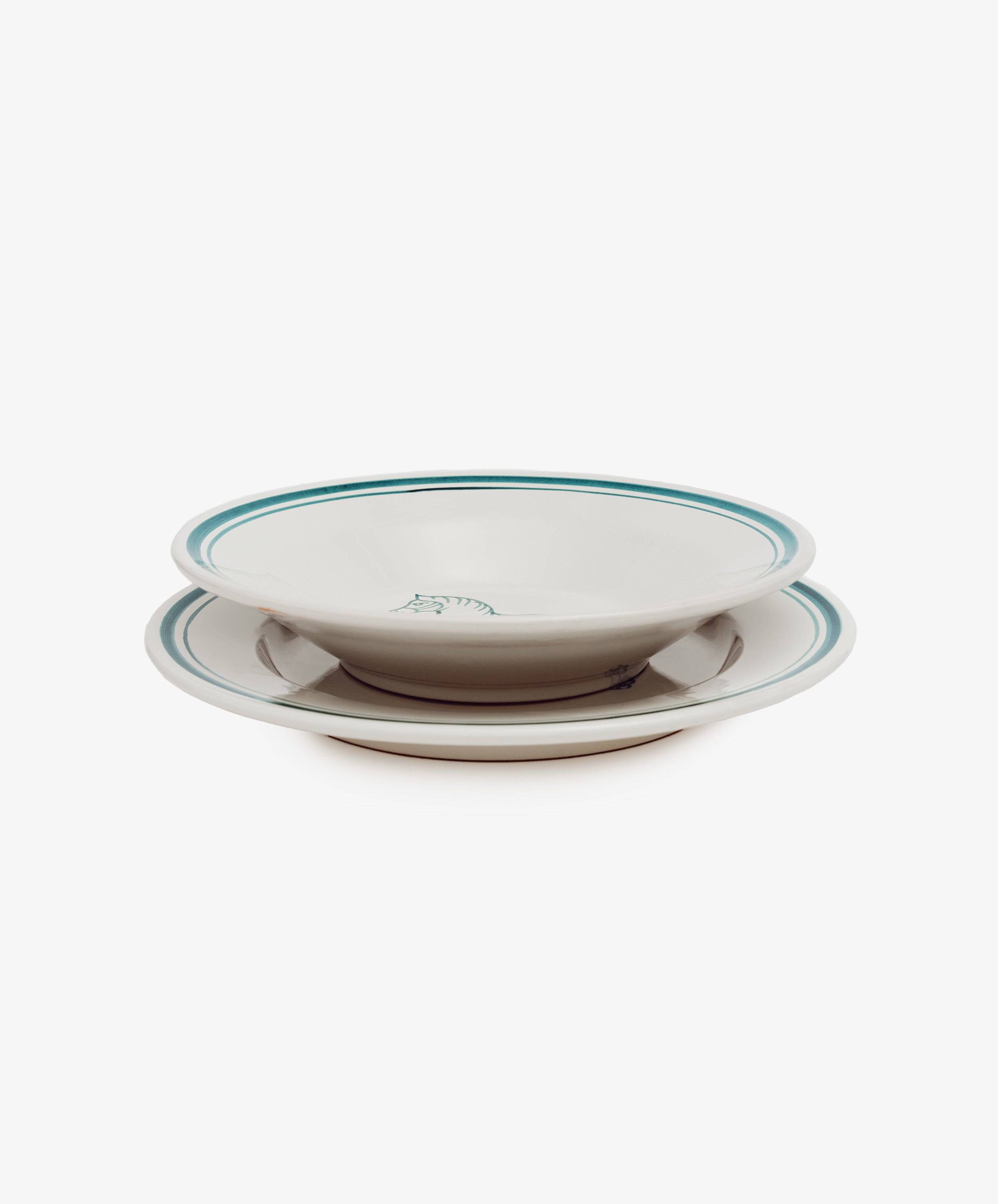 A white ceramic Folk Dinner Plate, Horse with green trim is shown with a matching bowl stacked inside, highlighting elegant Italian-inspired tableware against a plain white background.