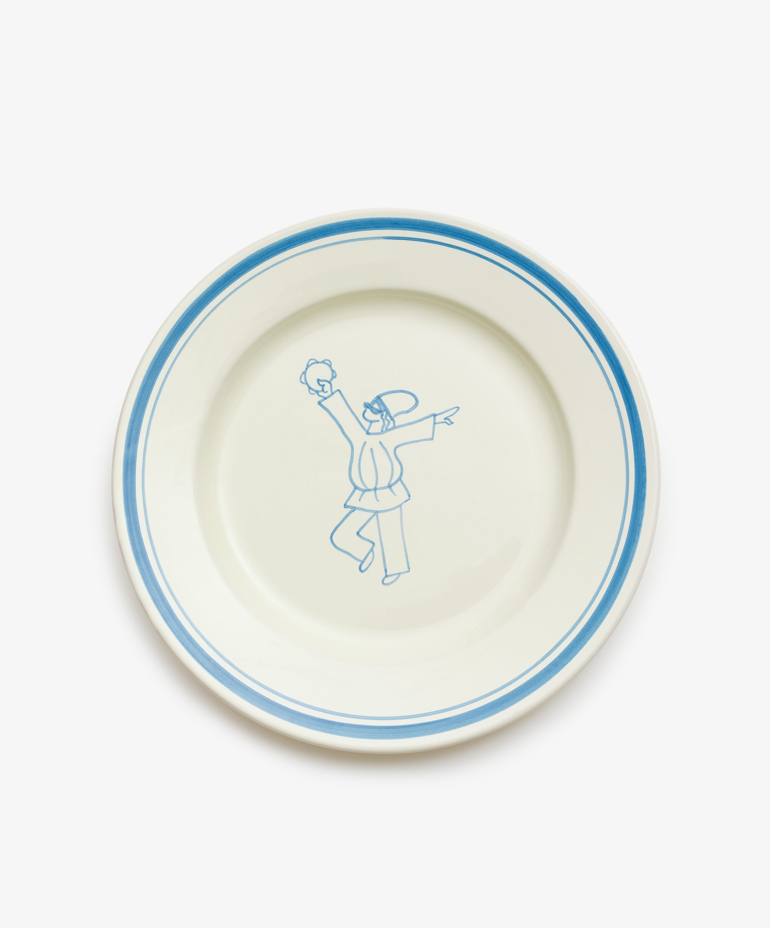 The Folk Dinner Plate, Jester, is a white ceramic plate with a blue rim and a hand-painted blue sketch of two people in the center, designed by an Italian ceramist to bring artistic charm to your table.