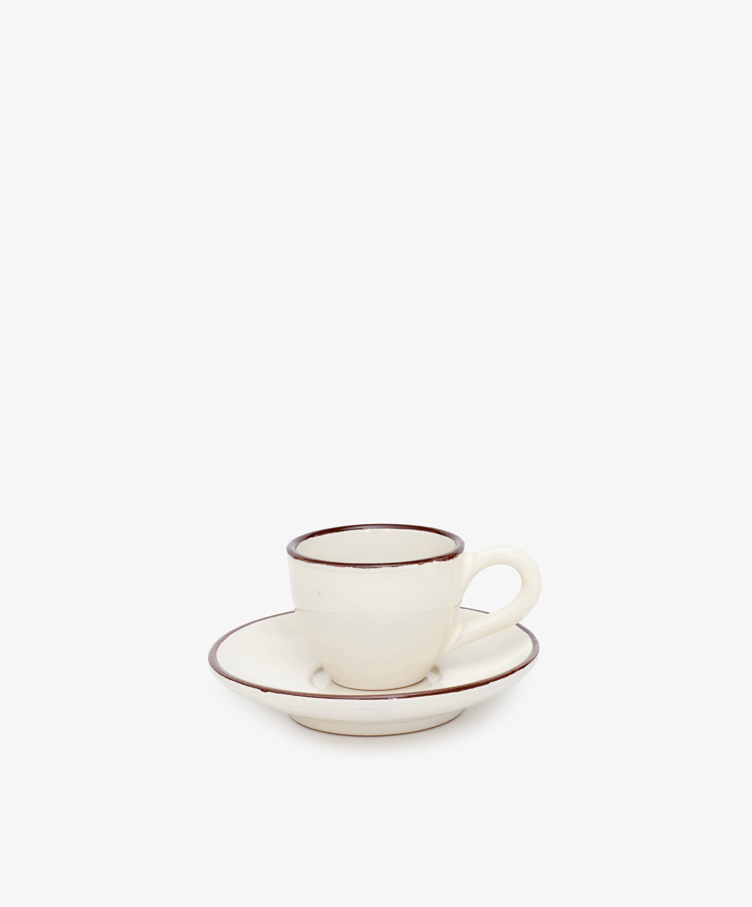 The Gio Espresso Set includes a handmade ceramic espresso cup with a handle and a matching saucer, both featuring brown trim, displayed against a plain white background.
