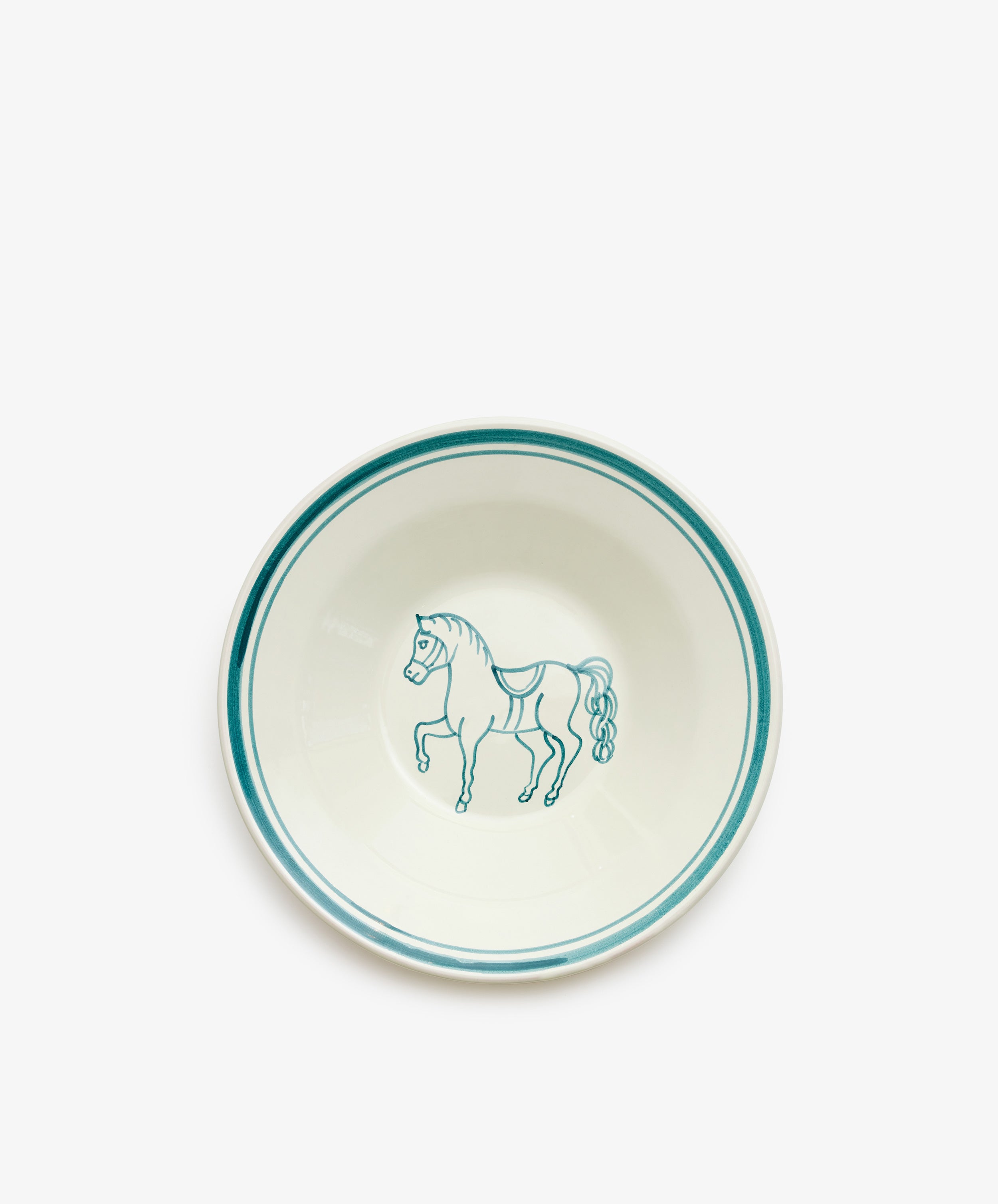 The Folk Pasta Bowl, Horse features a white ceramic design with teal rim accents and a hand-painted horse at the center, crafted by an Italian ceramist.