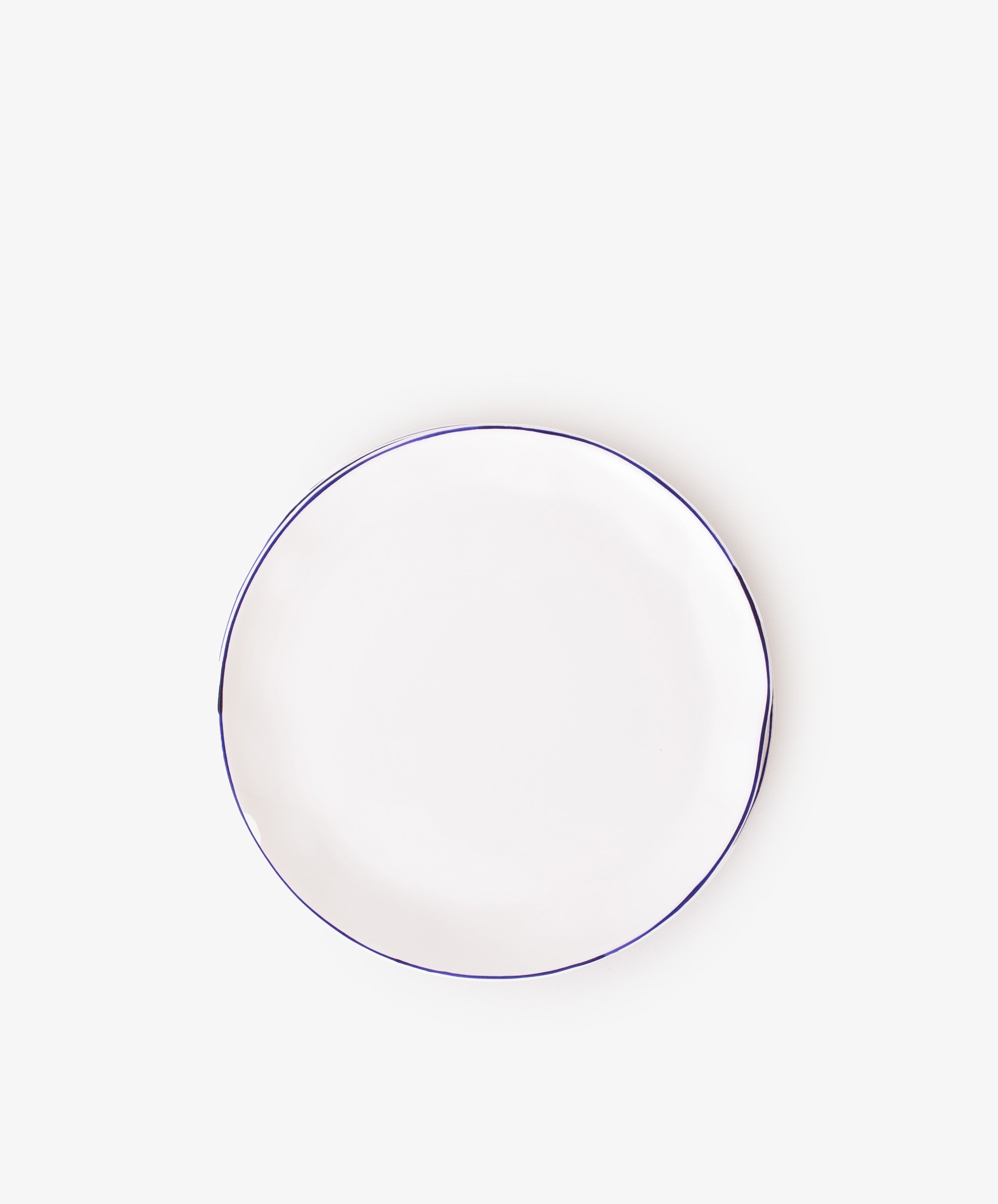 A set of 4 plain white ceramic cake plates with thin dark rims, ideal for serving tea or displaying treats, shown centered on a white background.