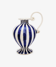 The Delphinia Bud Vase is a hand-thrown ceramic piece featuring blue-and-white vertical stripes, a round body, narrow neck, flared rim, and a sculptural scroll handle with intricate spiral details.