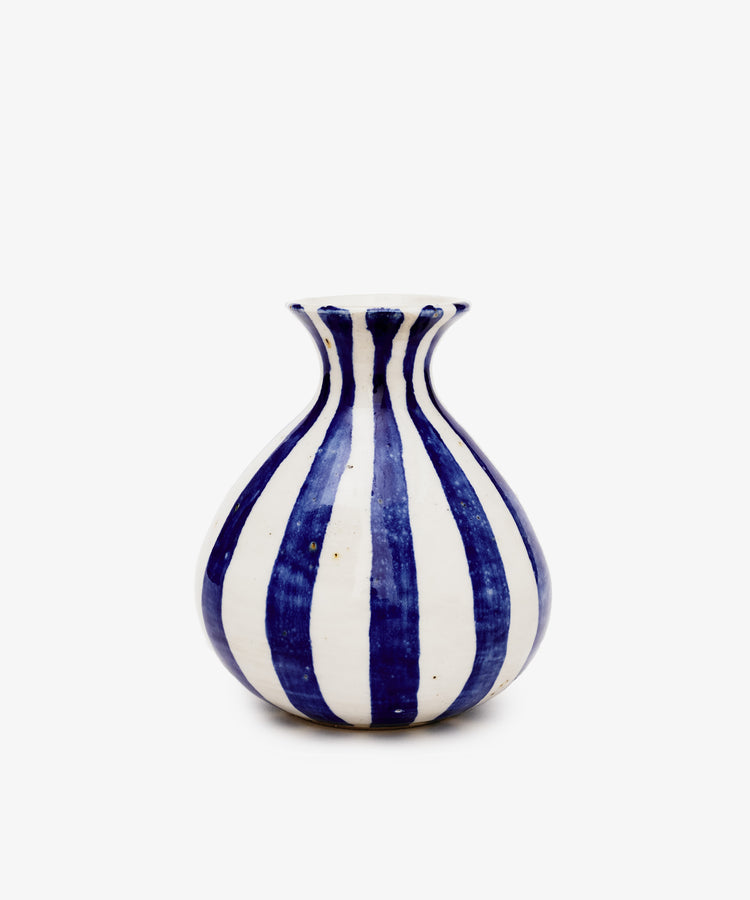 The Flora Bud Vase by George Bronwin is a hand-thrown ceramic piece with a round body, flared neck, and bold vertical cobalt stripes on a plain white background.