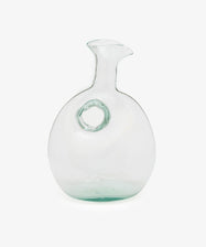 Alma Decanter. Transparent handblown glass sculptural decanter with circular shape and tapered spout.