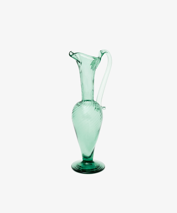 Alba Vase in Emerald Green. Elegant and elongated vase for liquids or flowers. Side view.