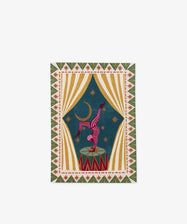 The PORTA Post is a colorful rectangular rug displaying a circus scene with a performer balancing on a drum, star patterns, curtains, handwritten words, and a crescent moon set against a blue background.