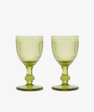 A set of six Celeste Red Wine Glasses, each with short stems and diamond-cut surfaces in subtle green, is displayed side by side on a white background.
