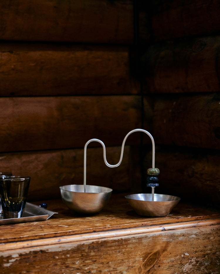 silver bowl on wood table