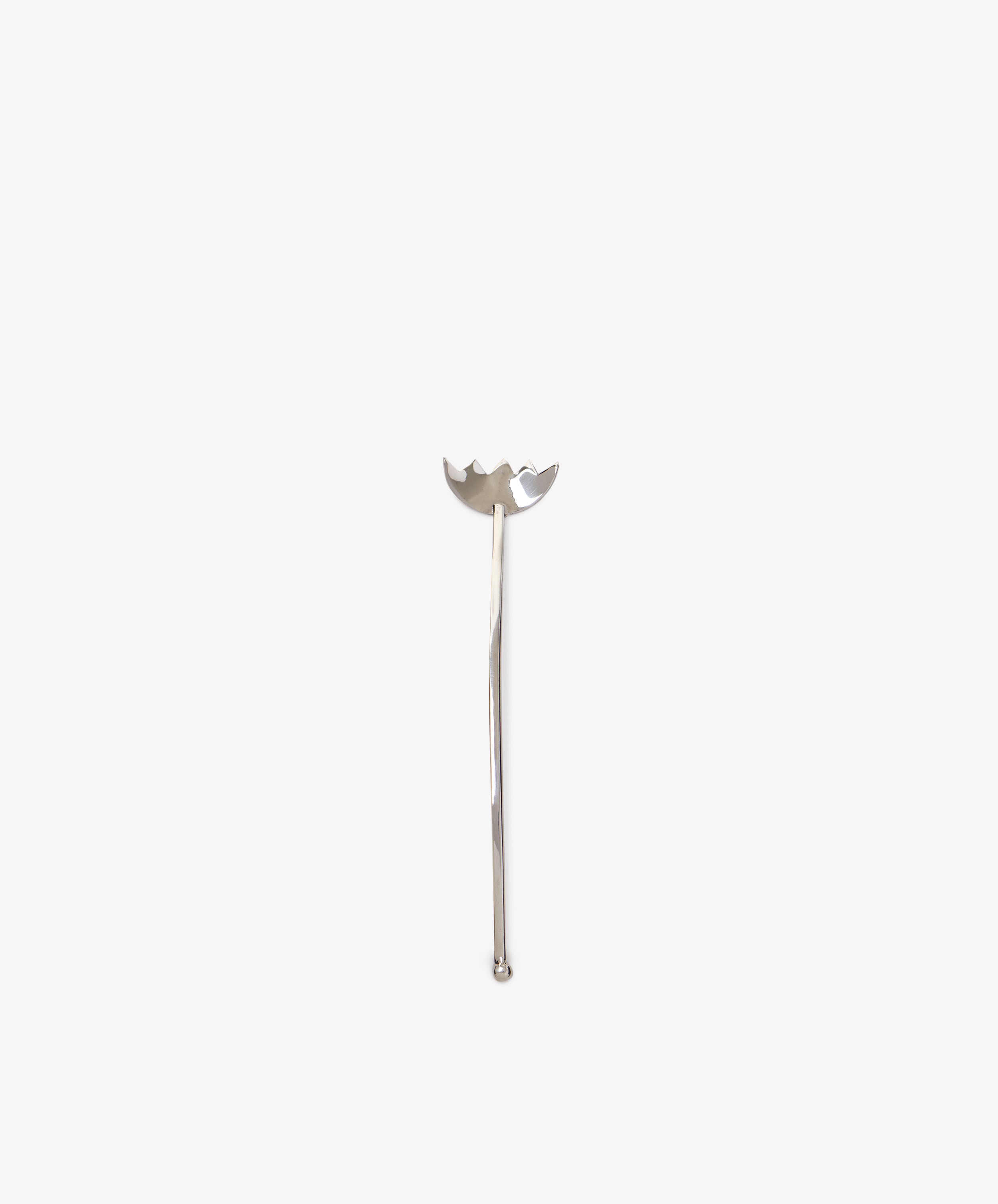 The Tinned Fish Fork features a distinctive, elegant design at the top and stands upright on a plain white background—a stylish and unique addition to any table.