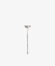 The Tinned Fish Fork features a distinctive, elegant design at the top and stands upright on a plain white background—a stylish and unique addition to any table.