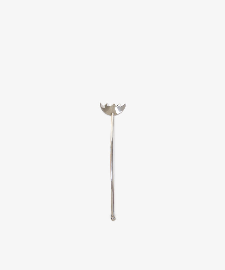The Tinned Fish Fork features a distinctive, elegant design at the top and stands upright on a plain white background—a stylish and unique addition to any table.