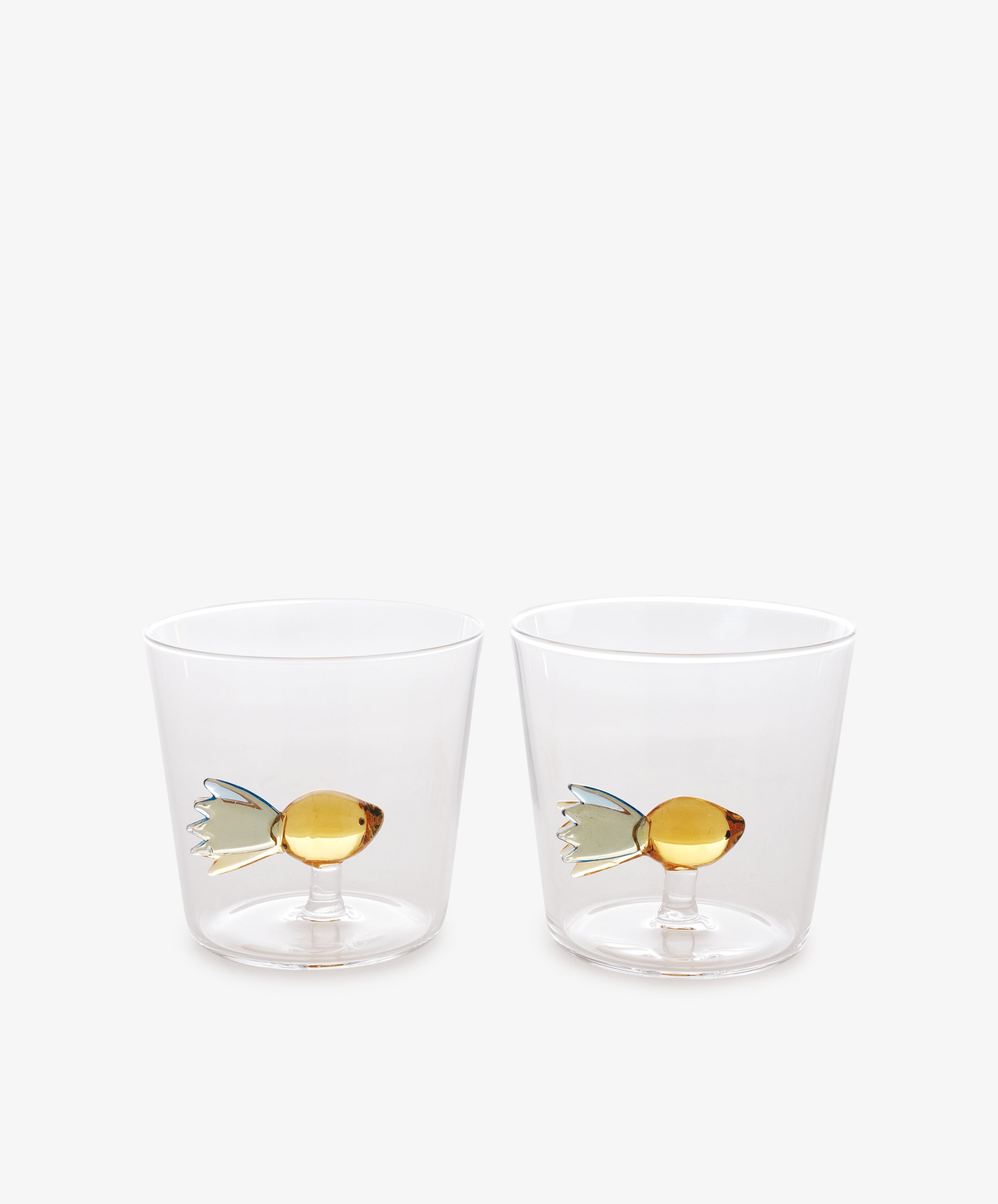 A set of two Ichendorf Milano Fish Tumblers, made from borosilicate glass with decorative fish designs, is displayed side by side on a plain white background.