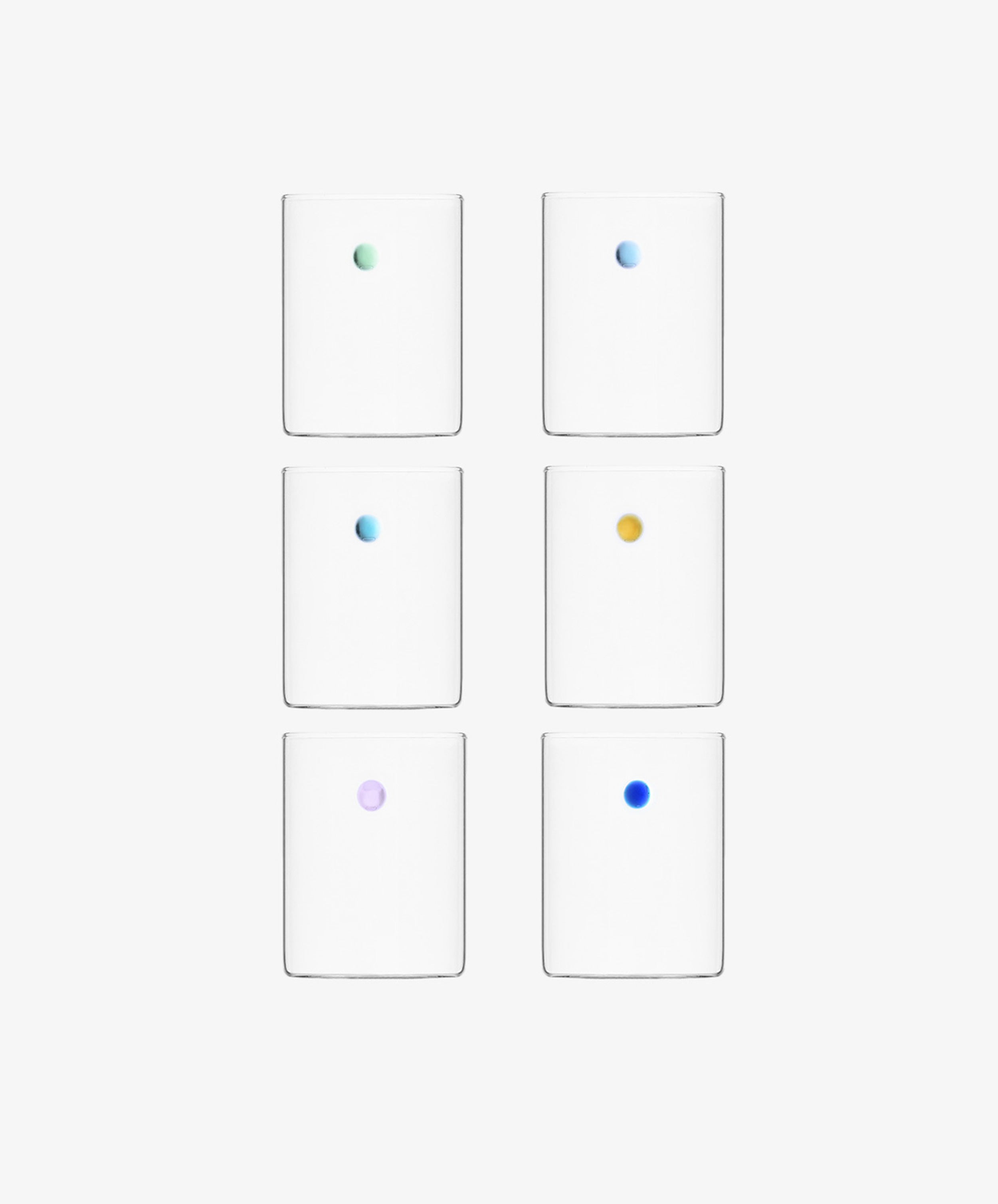 The Soleil Water Glass, Set of 6, features borosilicate glasses arranged in two columns and three rows, each with a single small colored dot at the center crafted using the lamp work technique.
