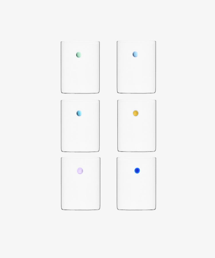 The Soleil Water Glass, Set of 6, features borosilicate glasses arranged in two columns and three rows, each with a single small colored dot at the center crafted using the lamp work technique.