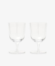 The Venezia Water Glass set of 6 features elegant, handblown clear glasses with short stems, displayed side by side on a plain white background—perfect glassware for any setting.