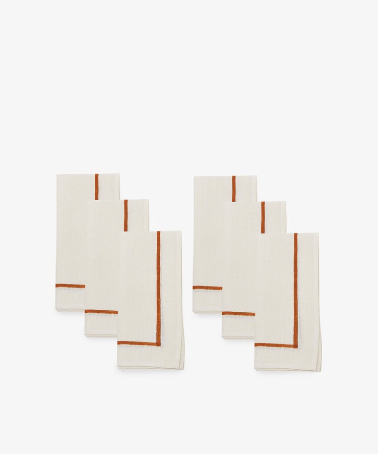 Riga Napkin. Two sets of three natural linen napkins with rust stitched stripe detail.
