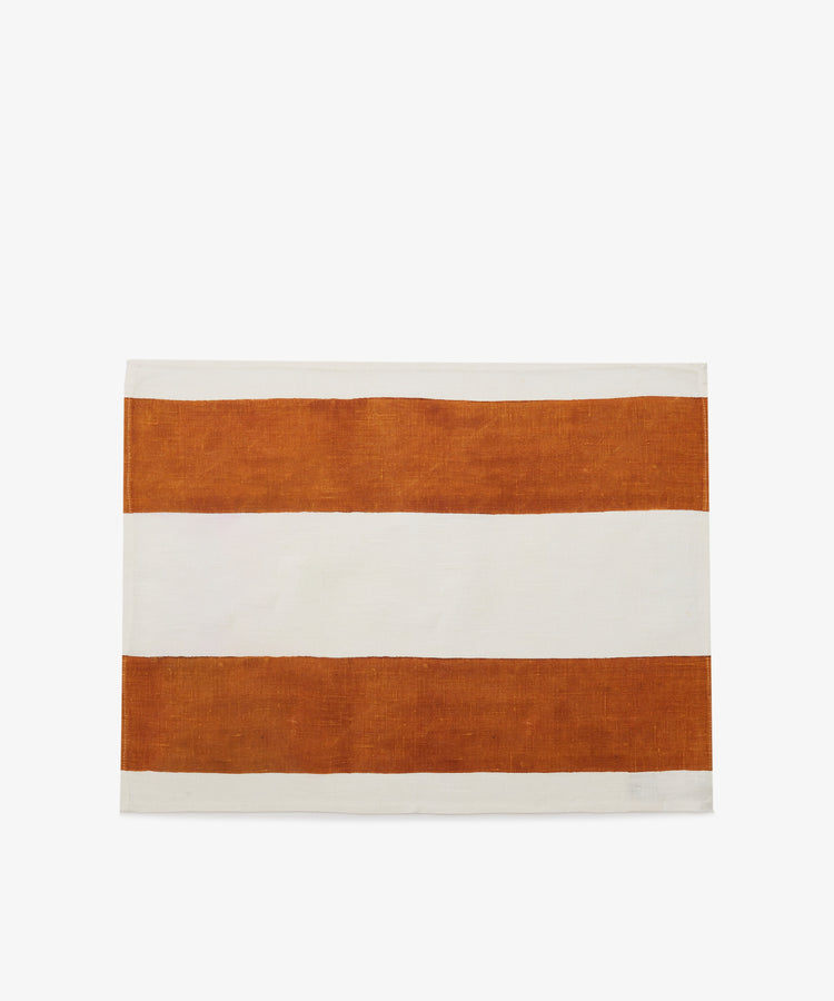 Riga Placemat. Folded white linen mat with thick rust stripes.