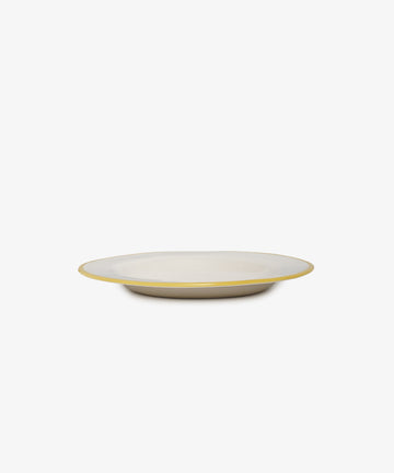 The Honey, youre the bees knees plate is a shallow, round handmade ceramic piece with a white surface and a thin yellow rim, inspired by Laetitia Rouget’s charm, shown against a plain white background.