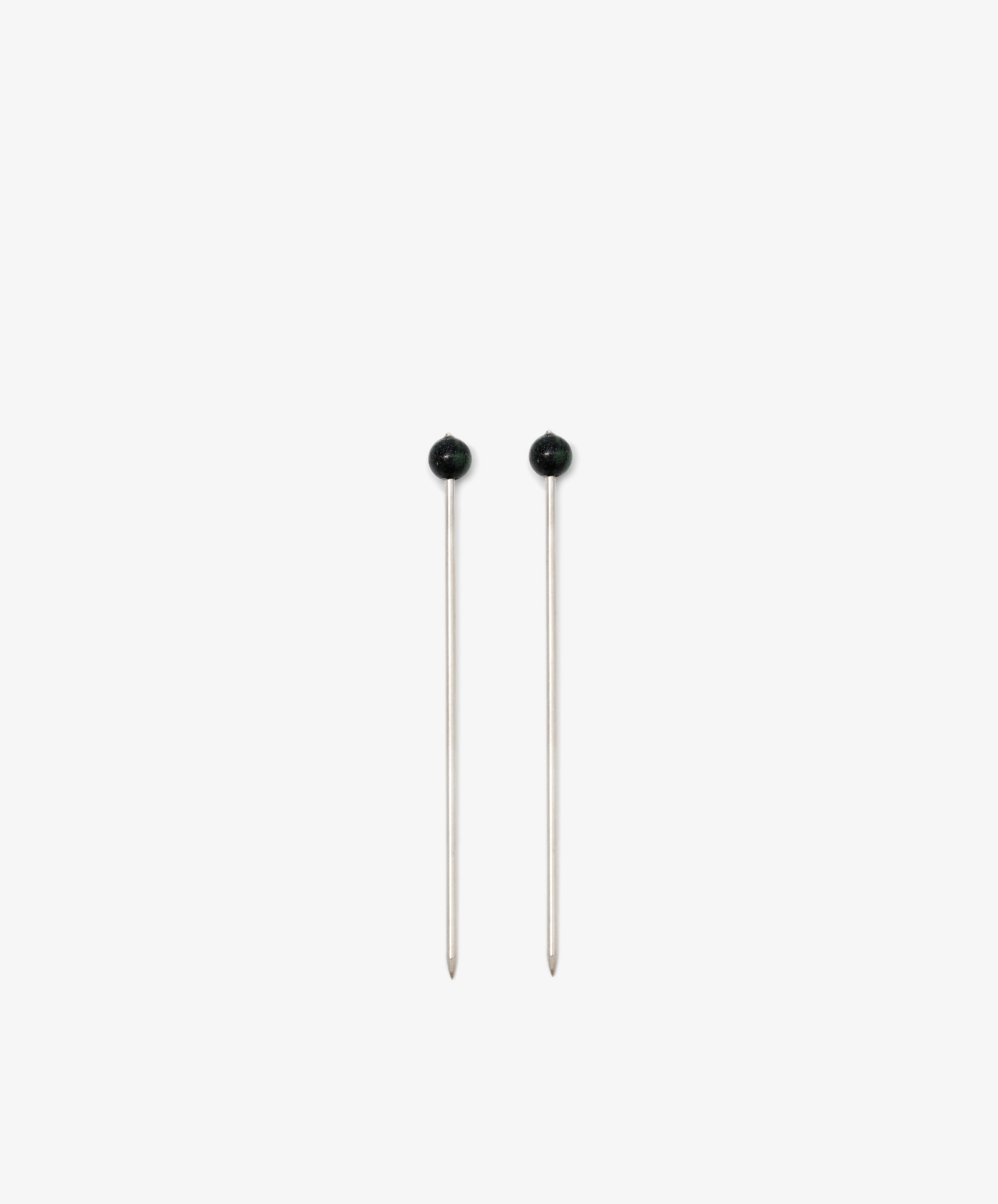The Ella Cocktail Sticks, Set of 2, feature silver shafts and round black heads. They are displayed vertically side by side on a plain white background.
