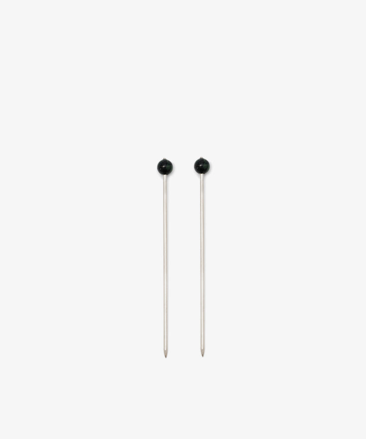 The Ella Cocktail Sticks, Set of 2, feature silver shafts and round black heads. They are displayed vertically side by side on a plain white background.
