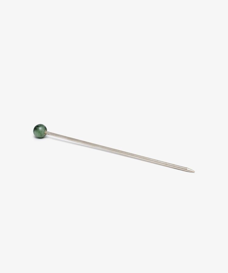 The Ella Cocktail Sticks, Set of 2, feature straight metal pins with distinctive green round heads and sharp pointed ends, perfect for cocktails and displayed on a plain white background.