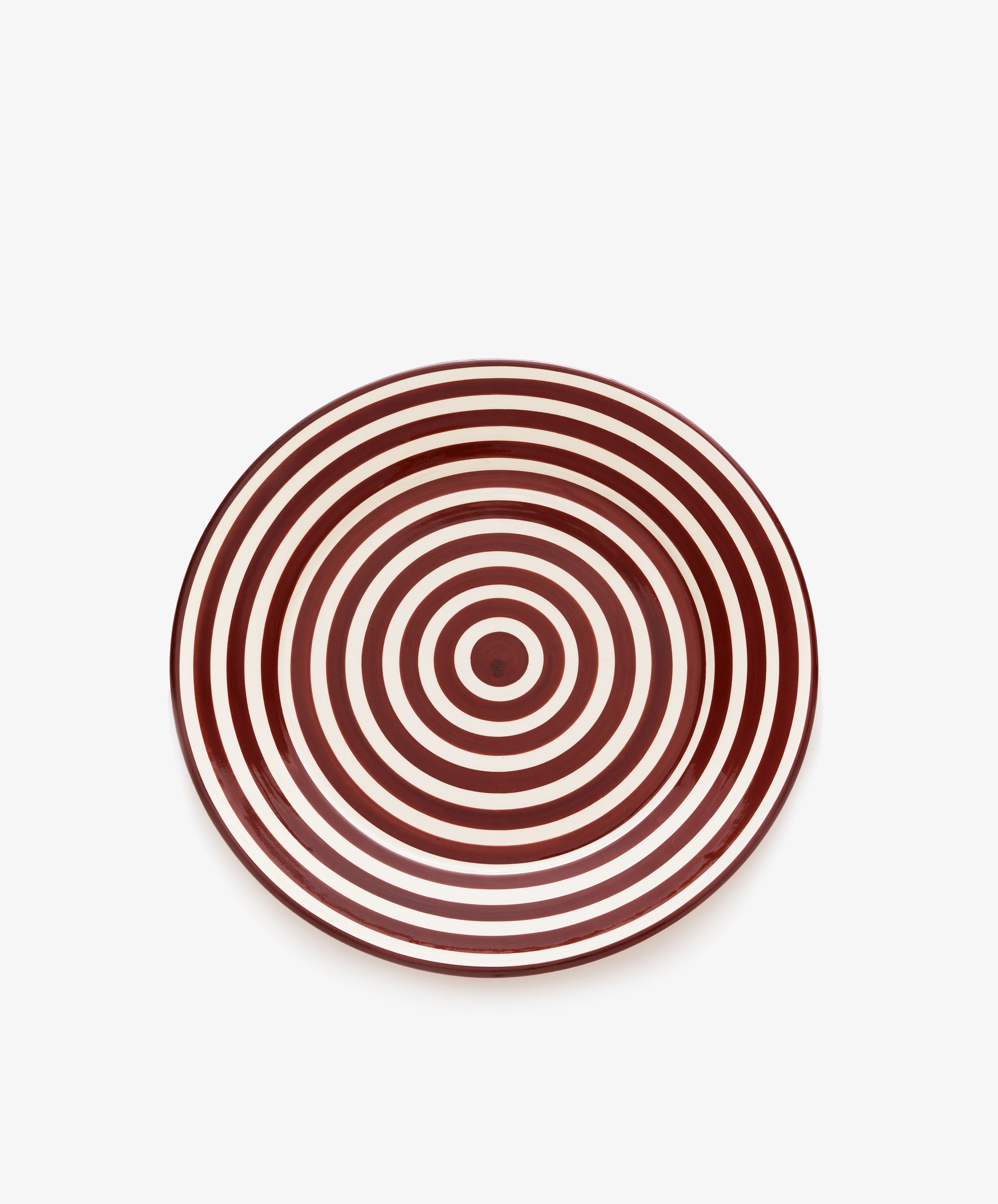 The Natalia Platter is a unique, handmade round platter featuring concentric red and white rings in a target-like pattern, shown on a plain white background.
