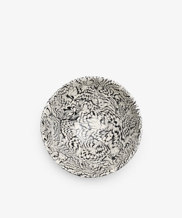 The Celine Salad Bowl is a round Aptware ceramic piece with intricate black and white marbled patterns inside, shown from above on a plain white background.