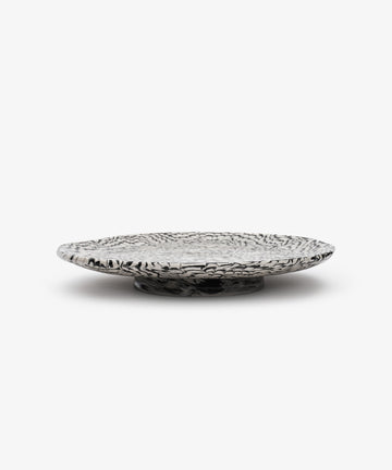 Black and white swirl platter, side view.