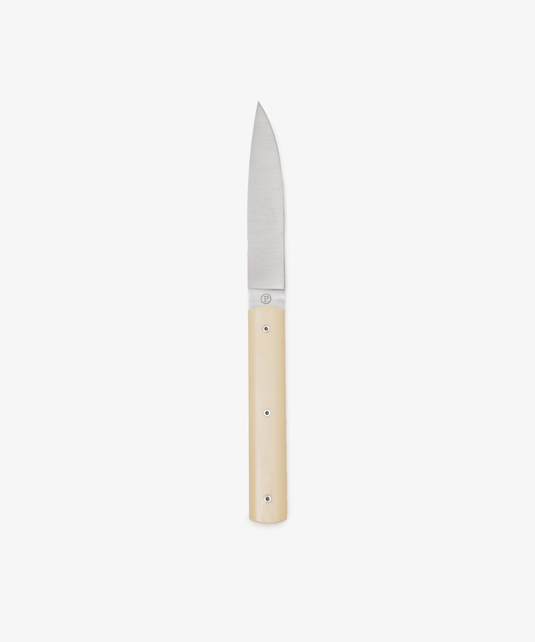 The 9.47 Table Knife is a small, handmade French knife with a straight stainless steel blade and a light-toned handle, photographed on a plain white background.