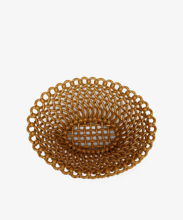 The Remi Decorative Fruit Bowl is a brown, oval showpiece with an open lattice design and ornate edges, displayed on a white background.
