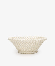 The Remi Decorative Fruit Bowl is a white glazed ceramic piece crafted to mimic a woven basket with hand-braided clay, shown against a plain white background—ideal as a unique decorative fruit bowl for your home.